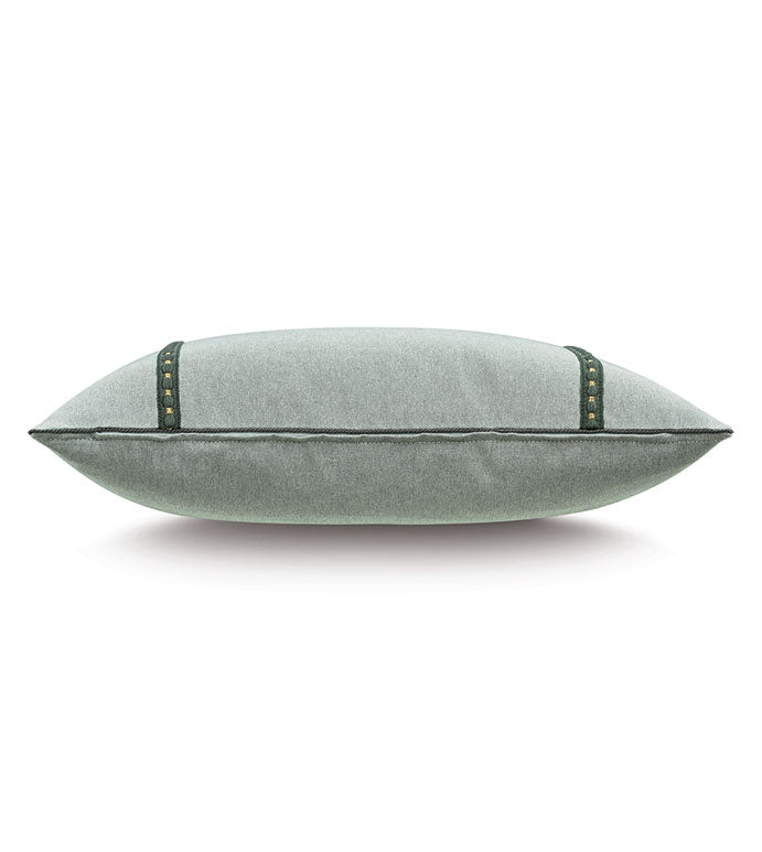 The Elspeth Gimp Pillow by Eastern Accents is shown from the side against a white background, featuring light gray cotton fabric with emerald trim and small bronze studs.