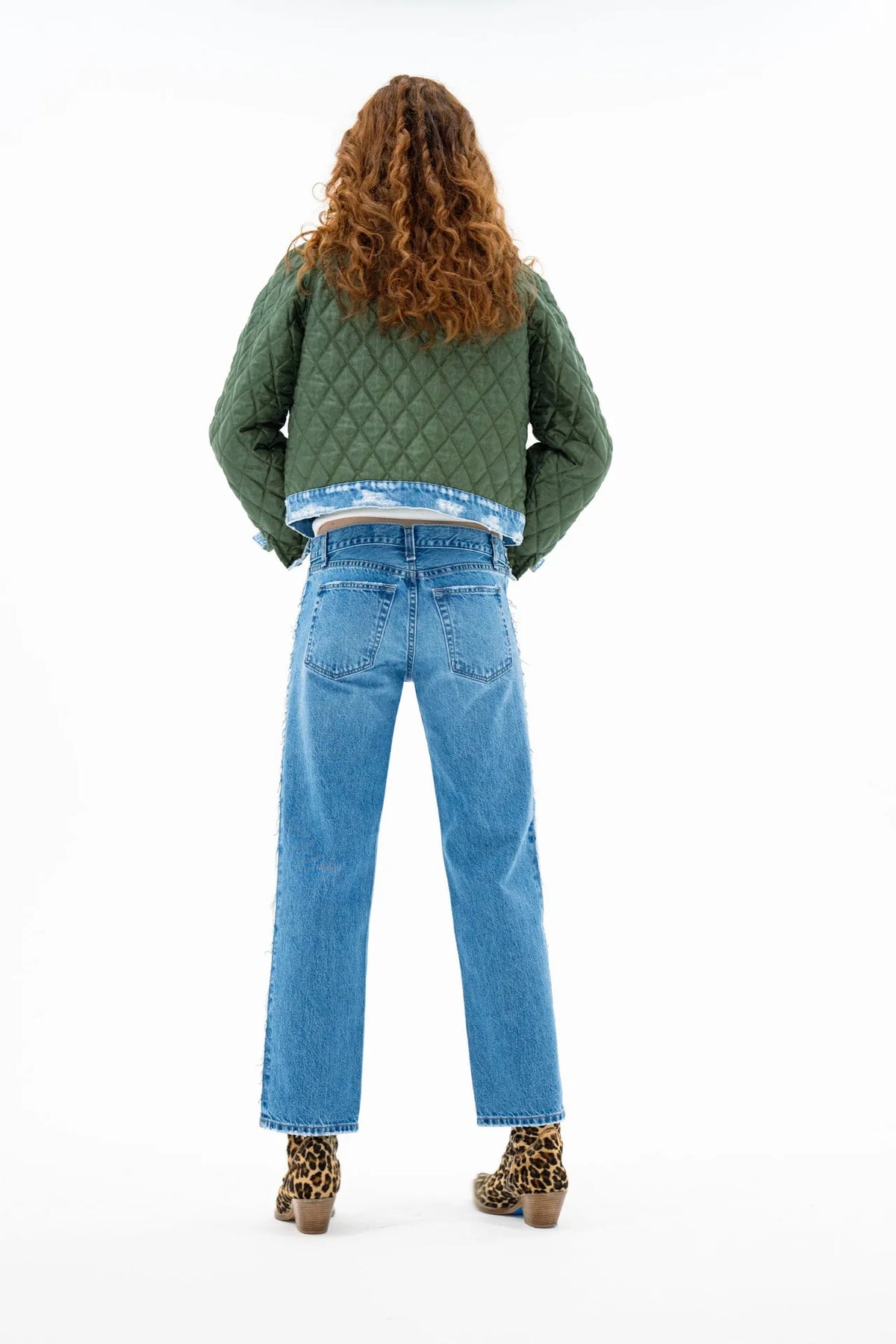 ASKK Bleecker Street Liner Jacket styled with blue jeans and leopard print boots, shown from the back.