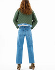 ASKK Bleecker Street Liner Jacket styled with blue jeans and leopard print boots, shown from the back.