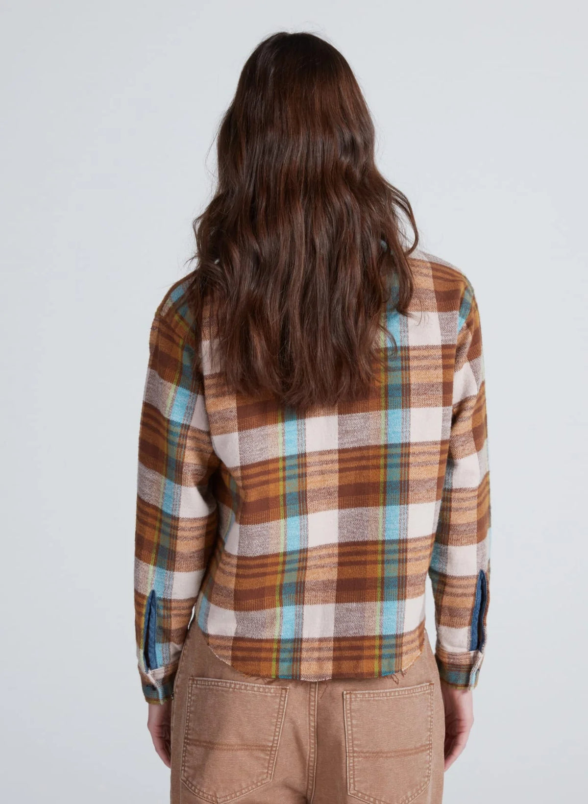 ASKK Crosby Flannel in pink plaid, shown from behind, styled with tan pants. Casual look by Bungalow Furniture & Accessories.