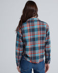 ASKK Crosby Flannel shirt in a plaid pattern, modeled from behind, paired with jeans.