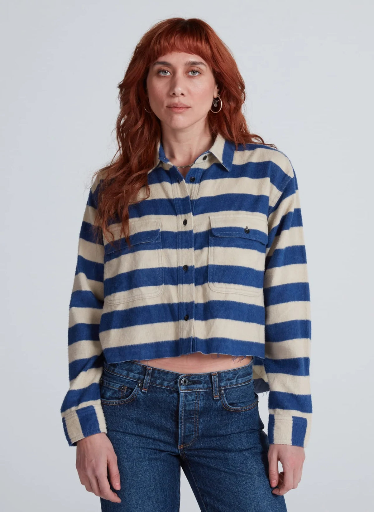 ASKK Crosby Shirt with wide blue and cream horizontal stripes, relaxed cropped fit, raw hem, and two chest pockets.