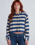 ASKK Crosby Shirt with wide blue and cream horizontal stripes, relaxed cropped fit, raw hem, and two chest pockets.