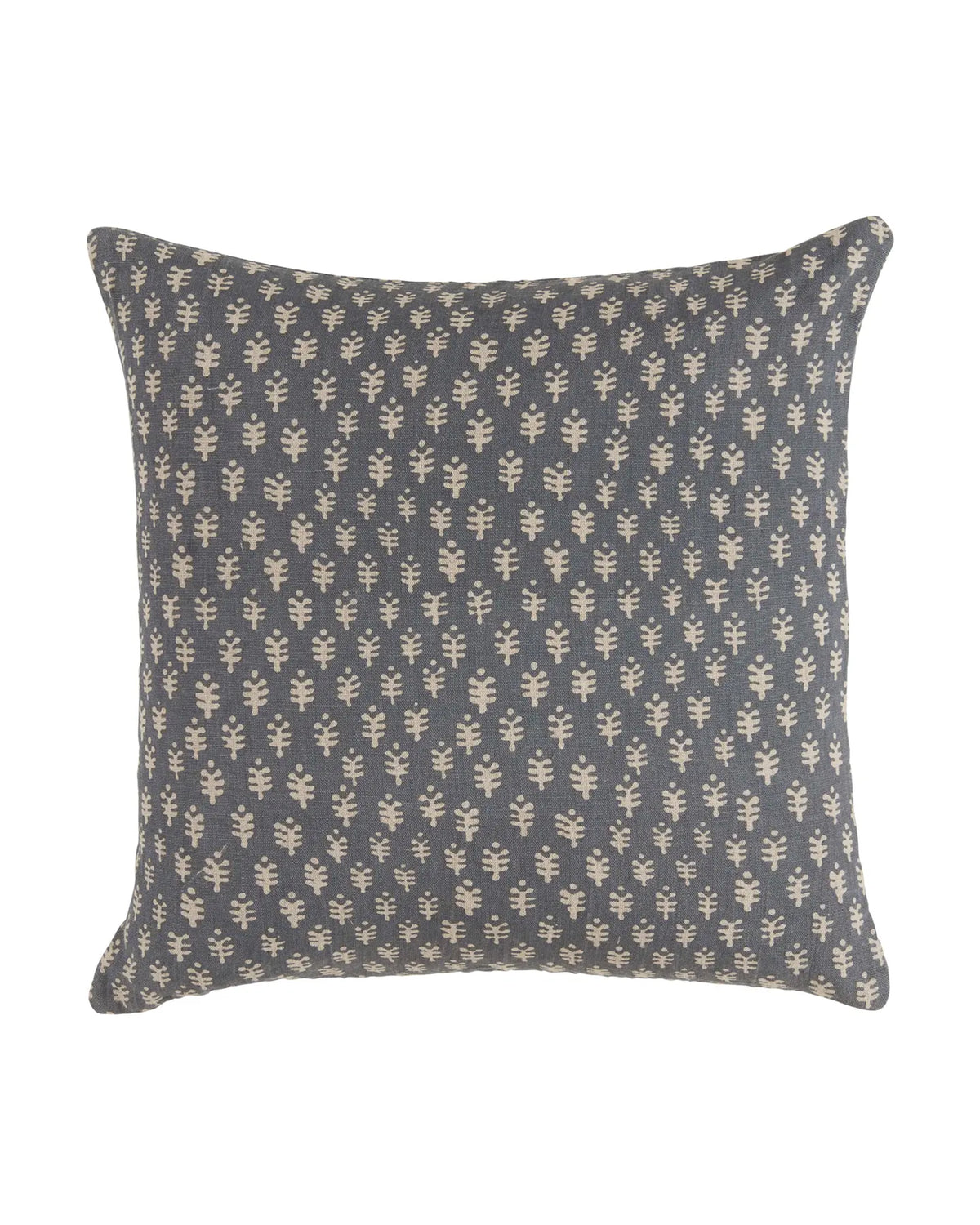 The Faire Astra Blue Pillow 22" x 22" features a dark grey background with a repeating beige leaf pattern, shown in the photo against a white backdrop.