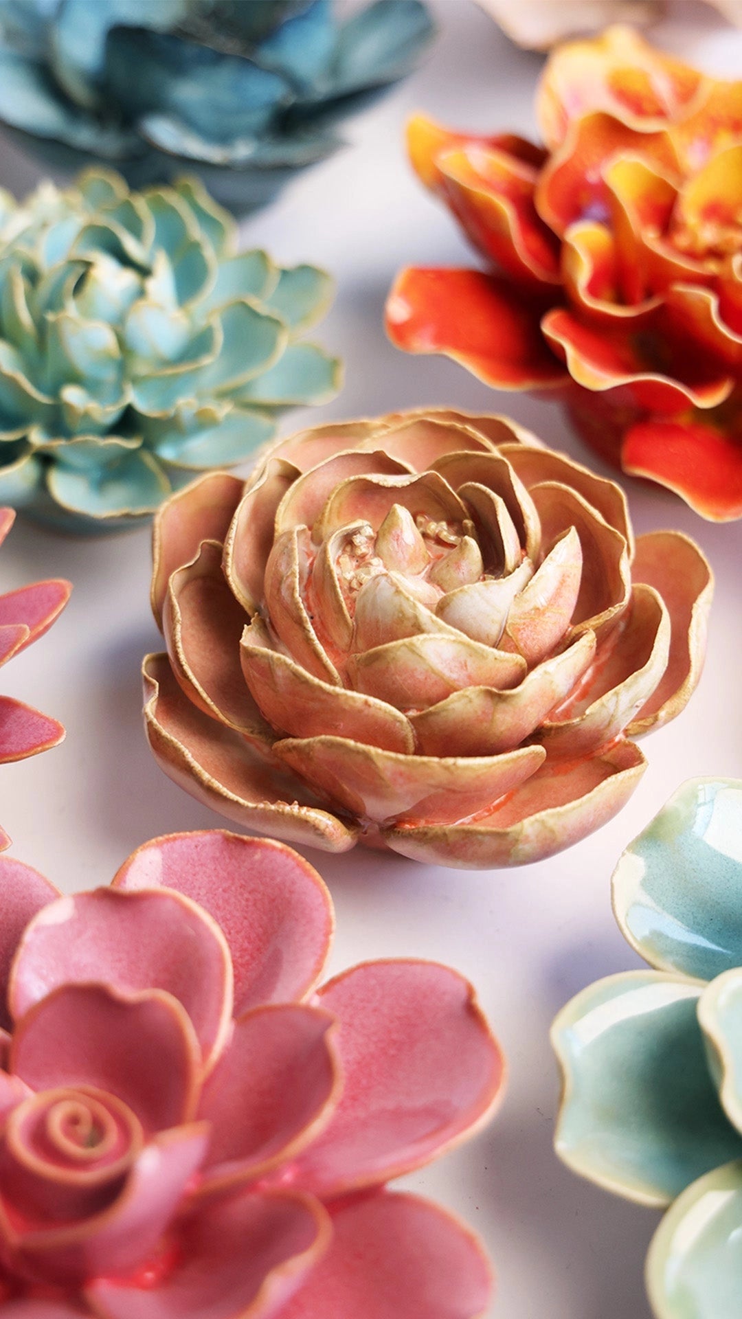 The Peach Pink Peony by Faire features detailed ceramic petals in pink and peach tones, artfully arranged for a vibrant accent—ideal as tabletop or wall decor to brighten any space.