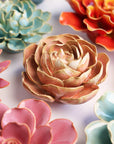 The Peach Pink Peony by Faire features detailed ceramic petals in pink and peach tones, artfully arranged for a vibrant accent—ideal as tabletop or wall decor to brighten any space.