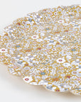 The Meri Meri x Liberty June's Meadow Small Tray by Faire features a decorative scalloped edge and detailed floral pattern in white, gold, blue, and red on mustard yellow, photographed against a plain white background.