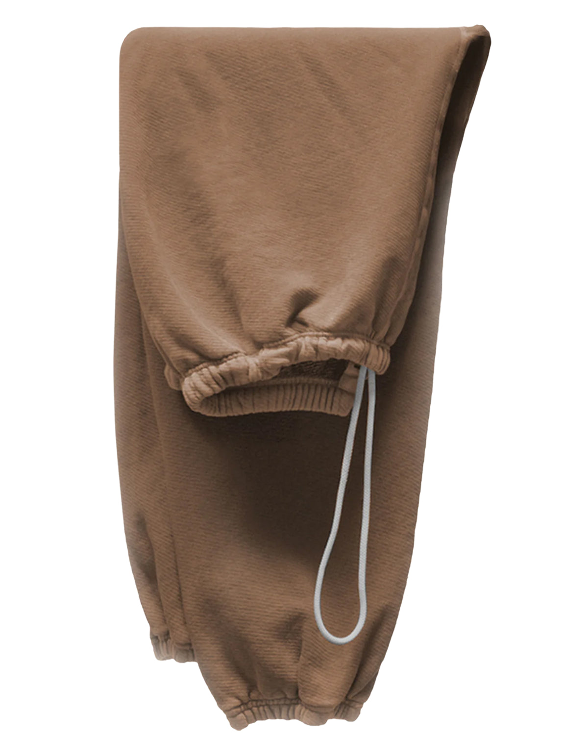 A pair of light brown BASIC GOODNESS OG SWEATPANTS by Free City (sparrow, LLC), folded lengthwise, featuring visible elastic cuffs and a white drawstring at the waistband.