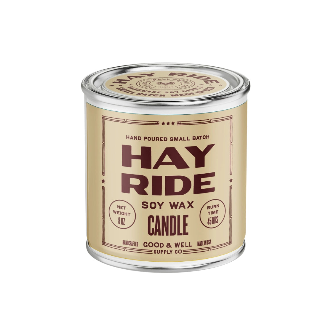 Hay Ride Soy Candle in a tan tin with cedarwood scent by Faire, perfect for fall ambiance.