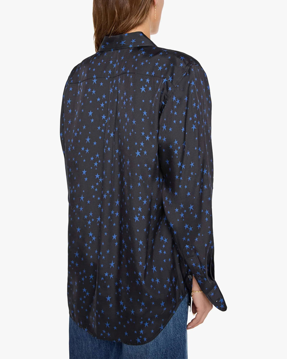 The Bestie button-up shirt in black with a blue star pattern, styled with blue jeans.