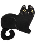Black cat-shaped pillow with stitched details and yellow eyes by Faire, adds playful accent to living room decor.