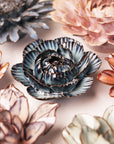 Handcrafted ceramic Navy Cabbage Flowers with blue, pink, and white layered petals, by Bungalow Furniture & Accessories.
