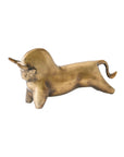 Antique brass bull sculpture with bronze tones, lying down, by Global Views, perfect for tabletop display.