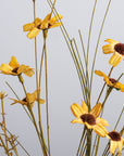 Gold Floral Pick with thin stems and dark brown centers from Bungalow Furniture & Accessories.