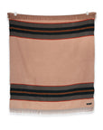 The S&A Blanket by Faire is a vintage-inspired rectangular beige throw with black and red stripes near the top and bottom and fringe detailing, shown laying flat against a white background.