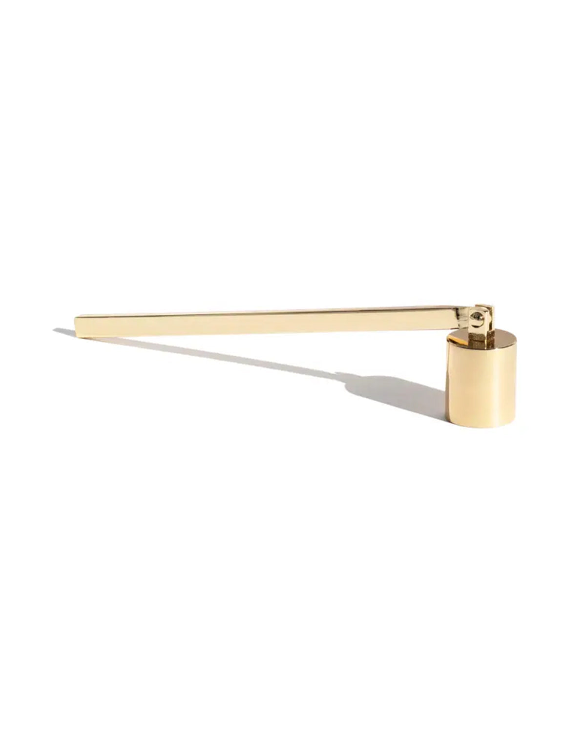 The Faire Candle Snuffer is a sleek, modern brass accessory with a long handle and cylindrical end, perfect for safely extinguishing candles. Elegantly displayed on a white background, it adds functional style to any home decor.