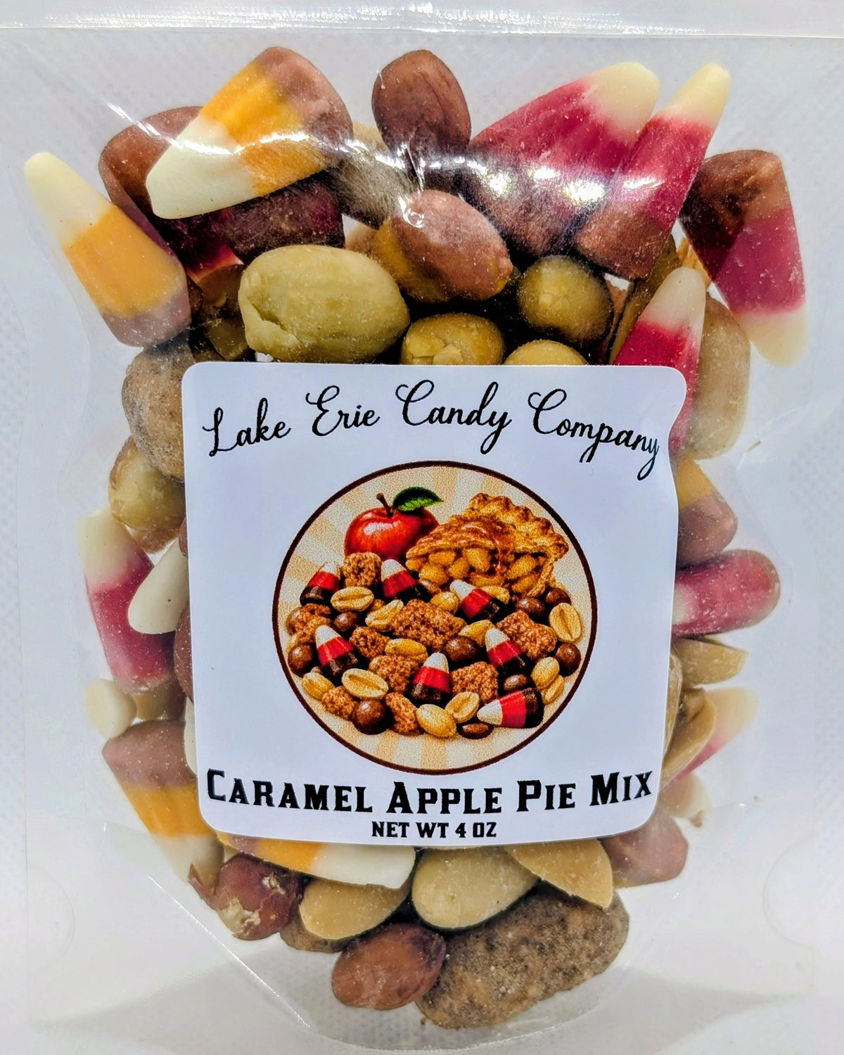 Faire Caramel Apple Pie Mix in a clear plastic bag with candy corn, peanuts, and cinnamon almonds.