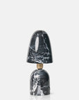 The Caswell Table Lamp by Abigail Ahern features a modern black marble-finish base and dome shade with white veining, connected by a gold accent—ideal for stylish accent lighting in any contemporary space.