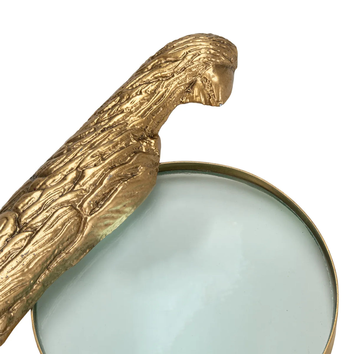 Norine magnifying glass with a textured gold-tone bird-shaped handle from Bungalow Furniture & Accessories.