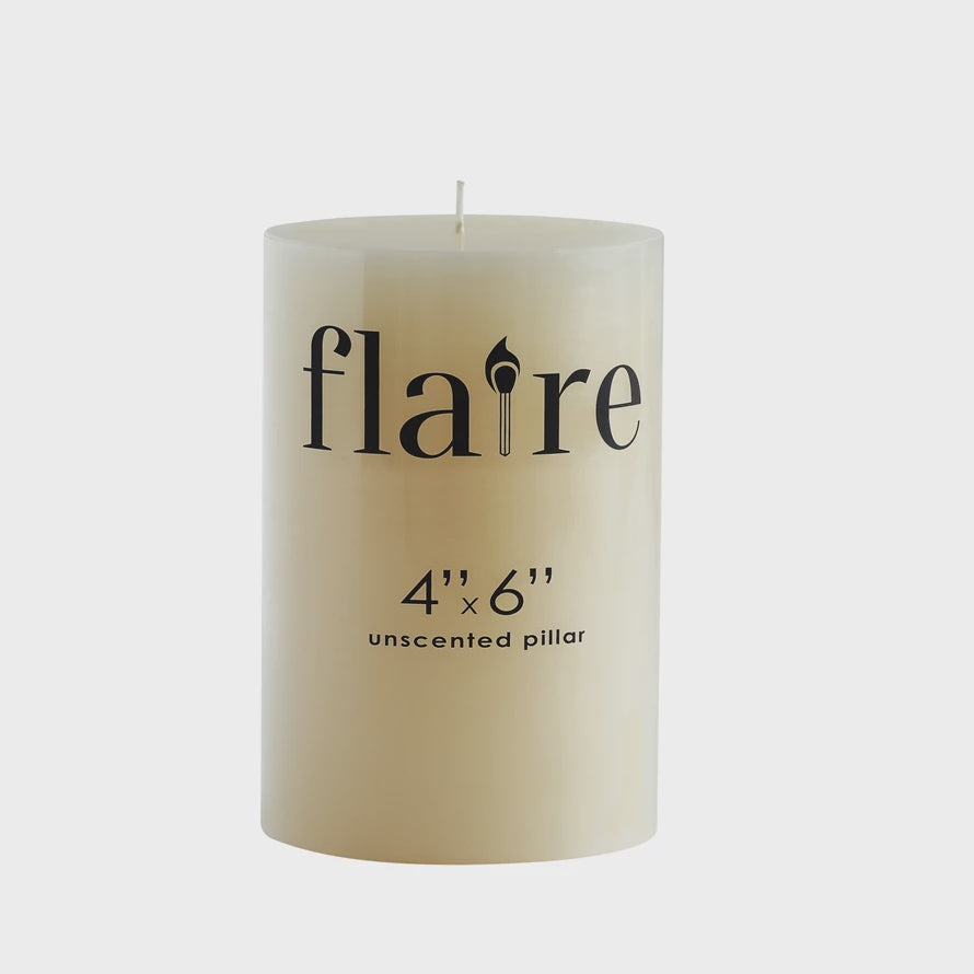A cream Unscented Piller Candle 4x6 by Creative Co-op, with "4'' x 6'' unscented pillar" in black text, features a 4" round x 6"H size and offers a clean burn time of up to 110 hours.