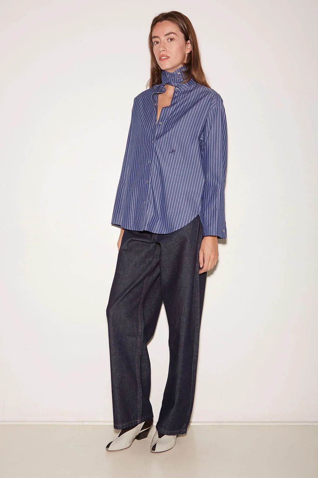 Roseanna Chemises Shirt with stand-up collar, pinstriped scarf, and dark wide-leg trousers.