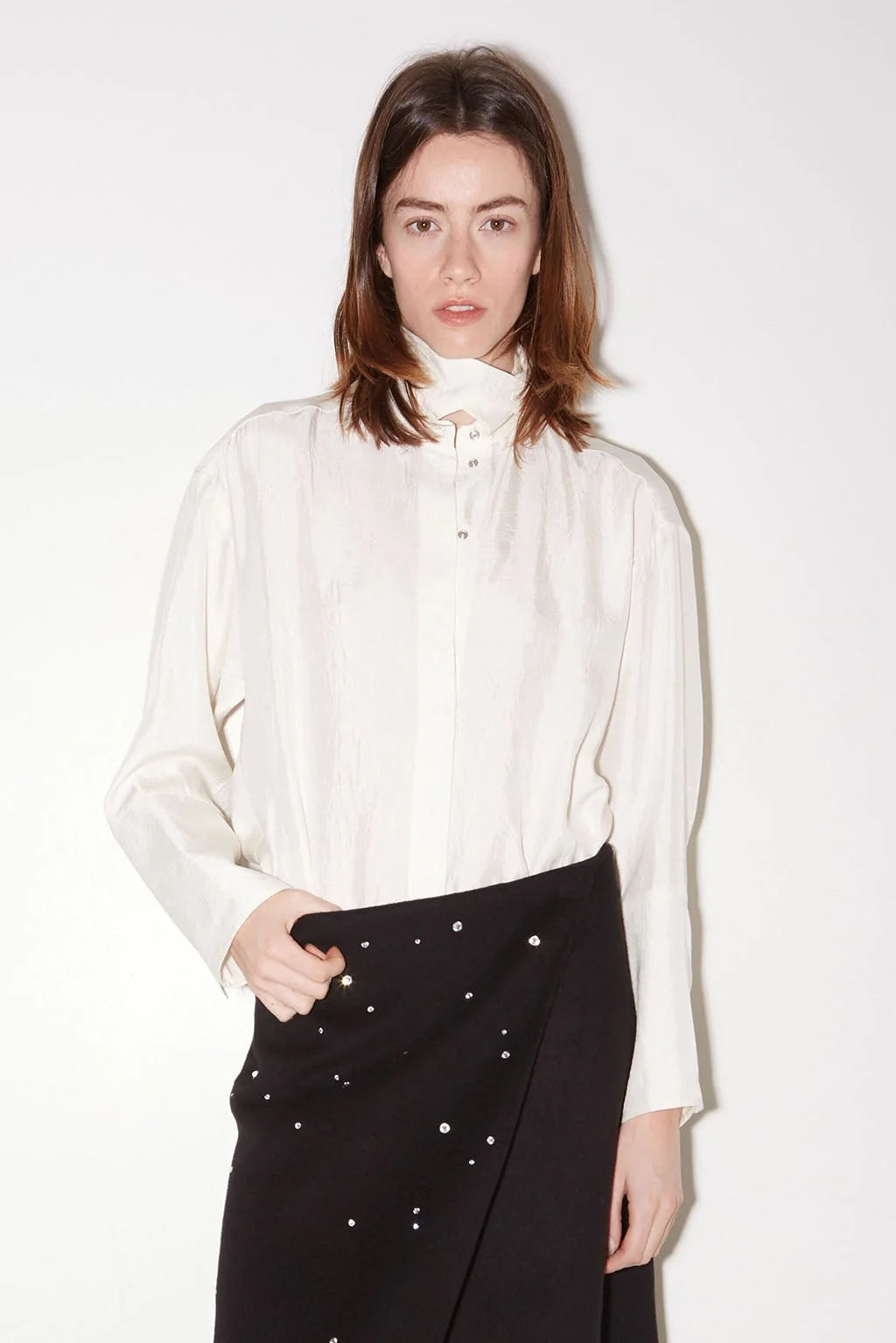 Roseanna Chemises loose-fit white shirt with stand-up collar and black studded skirt by Bungalow.