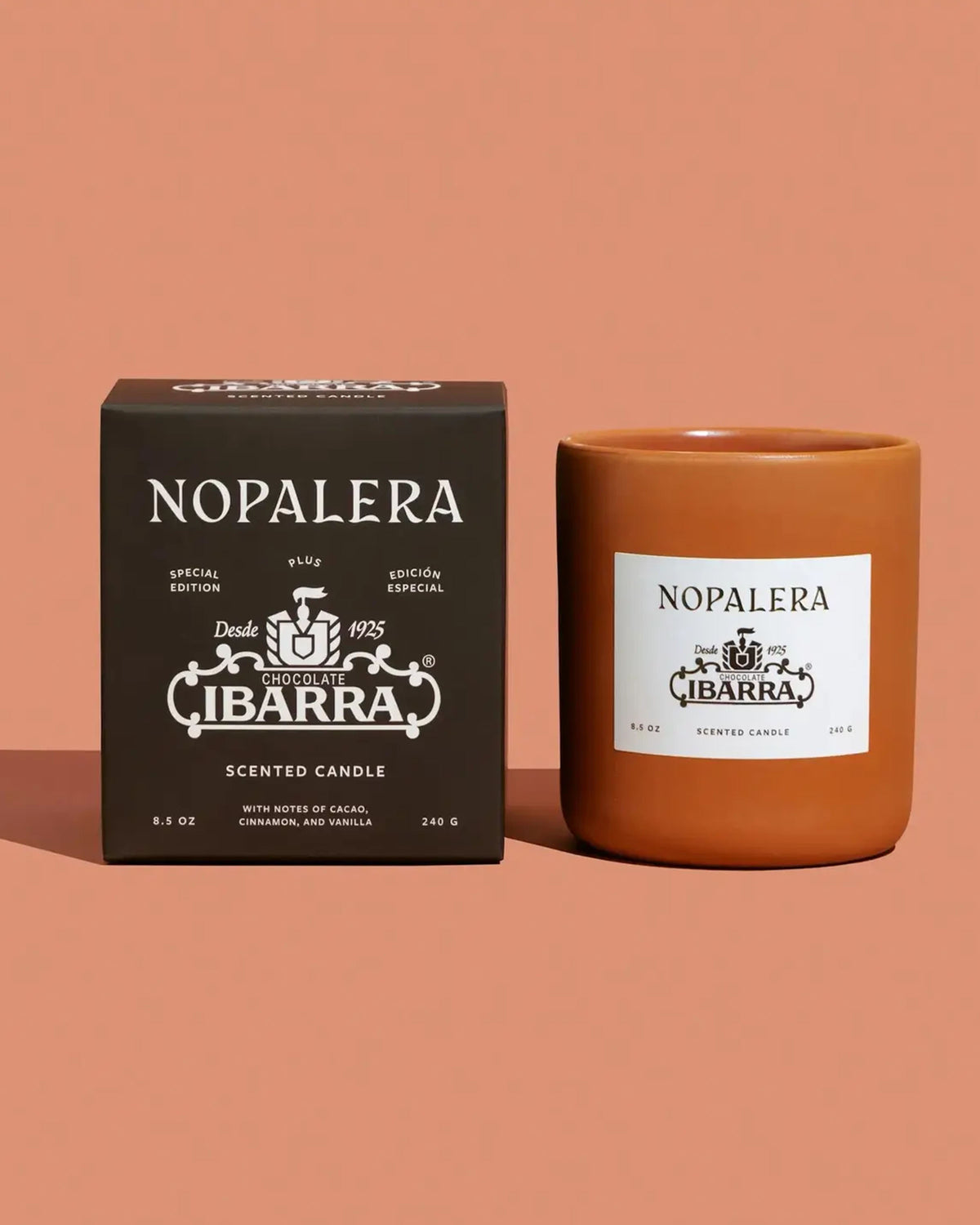 A brown box and matching candle jar with white "Nopalera" and "Ibarra" labels are shown on a light brown background. The Faire Nopalera Chocolate Candle is a limited edition inspired by the rich scent of Ibarra chocolate.