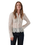 White floral lace Cissa VERONA button-down blouse paired with dark blue jeans.
