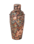The Creative Co-op Stainless Steel Cocktail Shaker has an oxidized copper finish with blue-green marbling, a rounded lid, and a tall cylindrical shape—ideal for vintage barware enthusiasts.