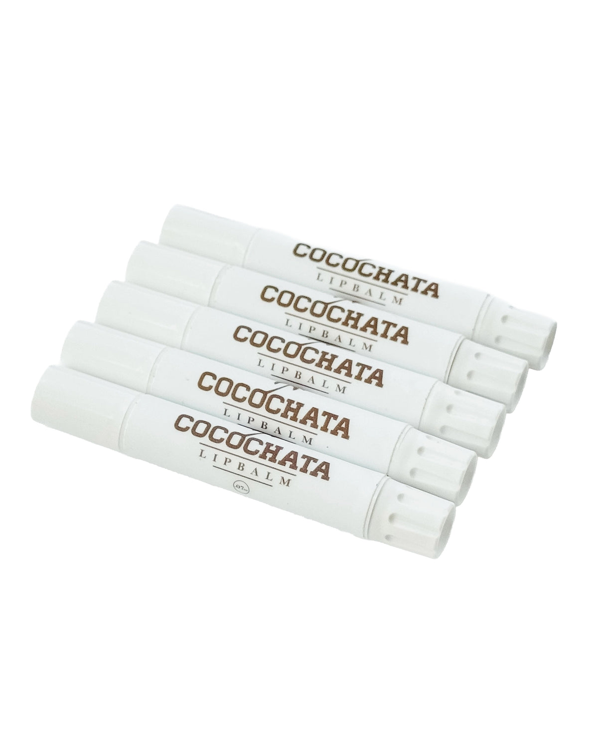 Four white tubes of Faire Cocochata Lip Balm, featuring the product name in brown, are stacked diagonally. Made with organic coconut oil for lasting hydration, the tubes are set against a white background.