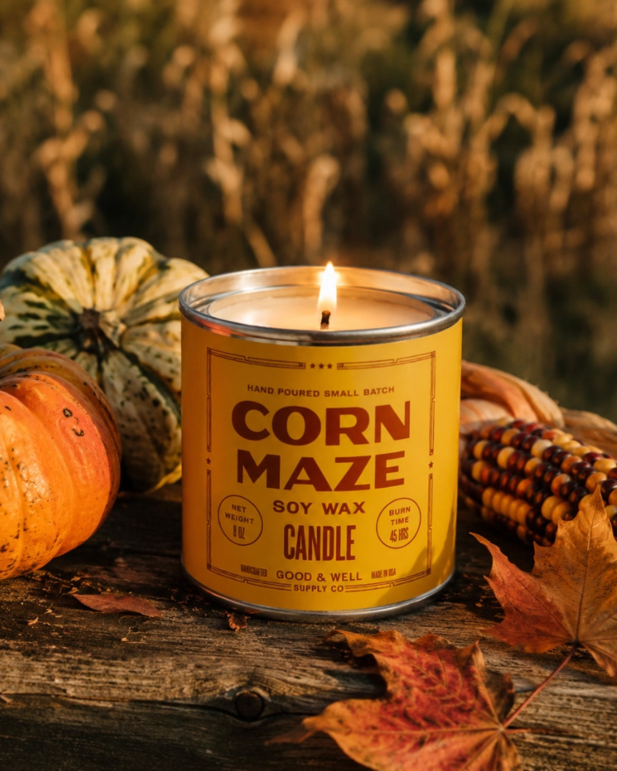 Soy candle with pumpkins, corn, and spice leaves on wood, Faire Corn Maze scent for Bungalow Furniture & Accessories.