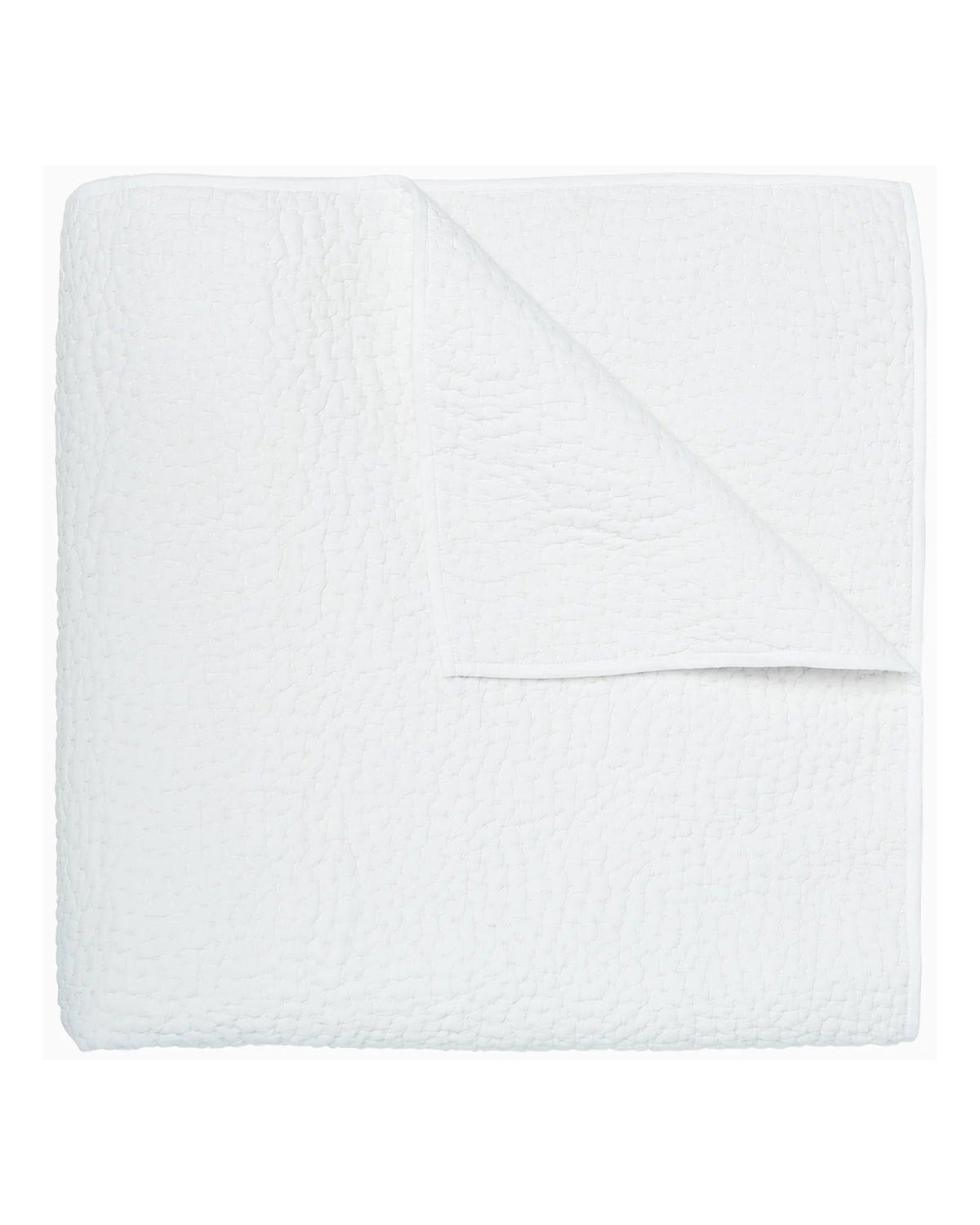 The John Robshaw Hand Stitched Coverlet Queen, in white organic cotton, is neatly folded to show its reversible design and subtle hand-stitched pattern for extra charm.