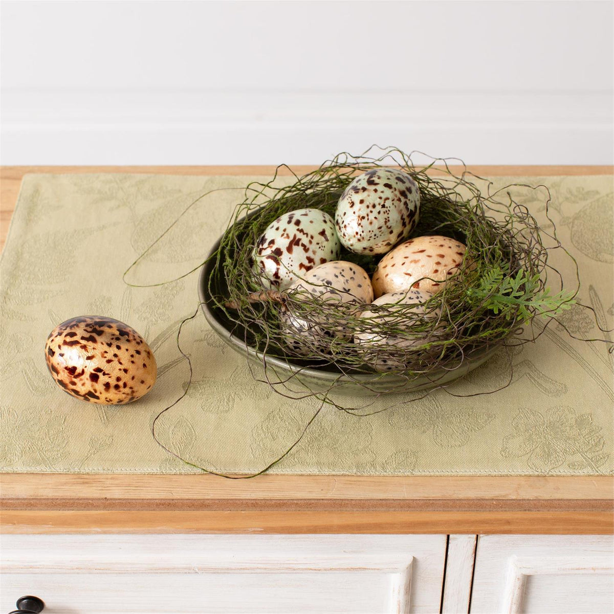 Set of 8 capiz speckled eggs, five in a nest and one beside, by Faire for Bungalow Furniture & Accessories.