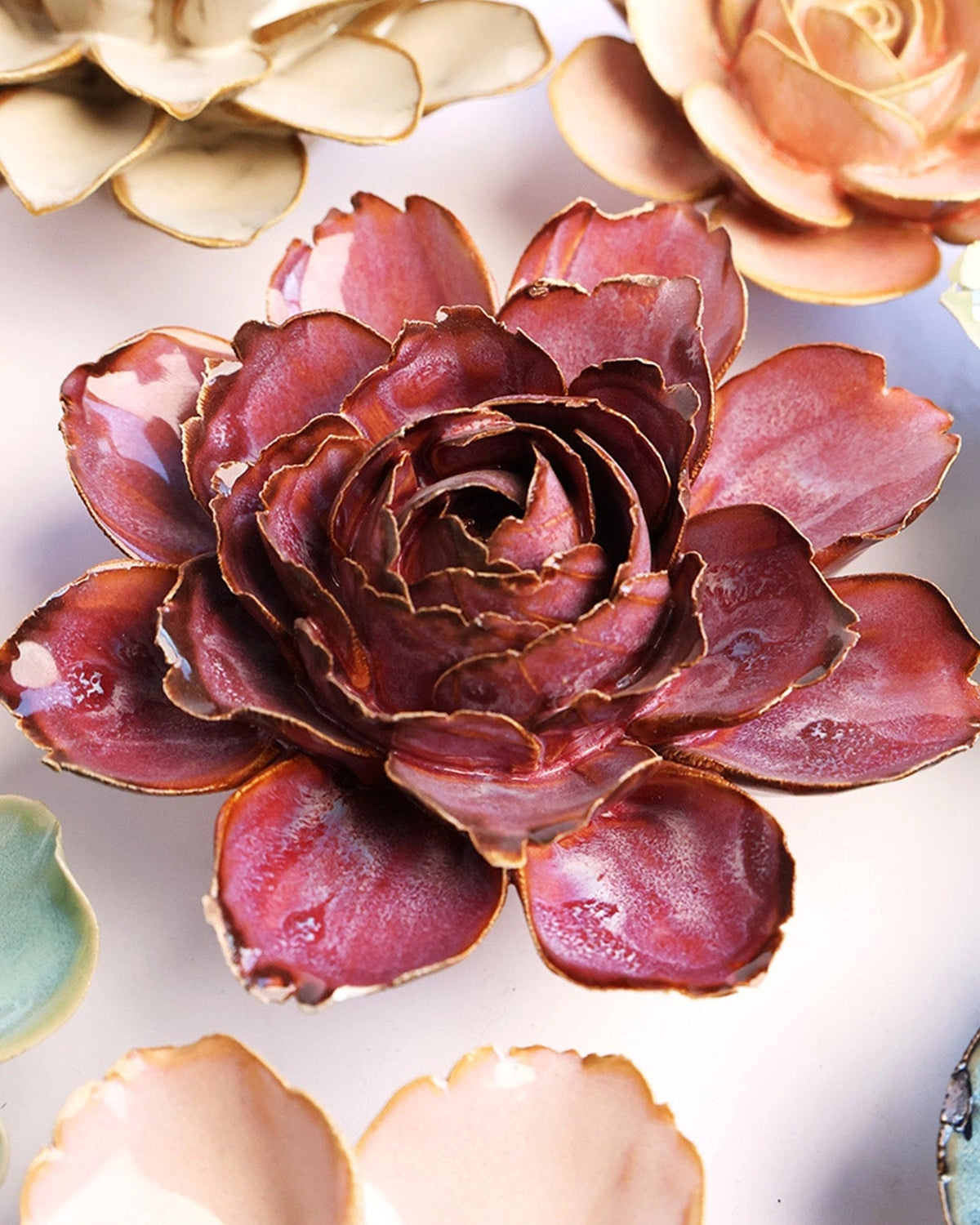Dewberry Camellia Botanicals ceramic flower in deep reddish-purple with layered, ruffled petals.