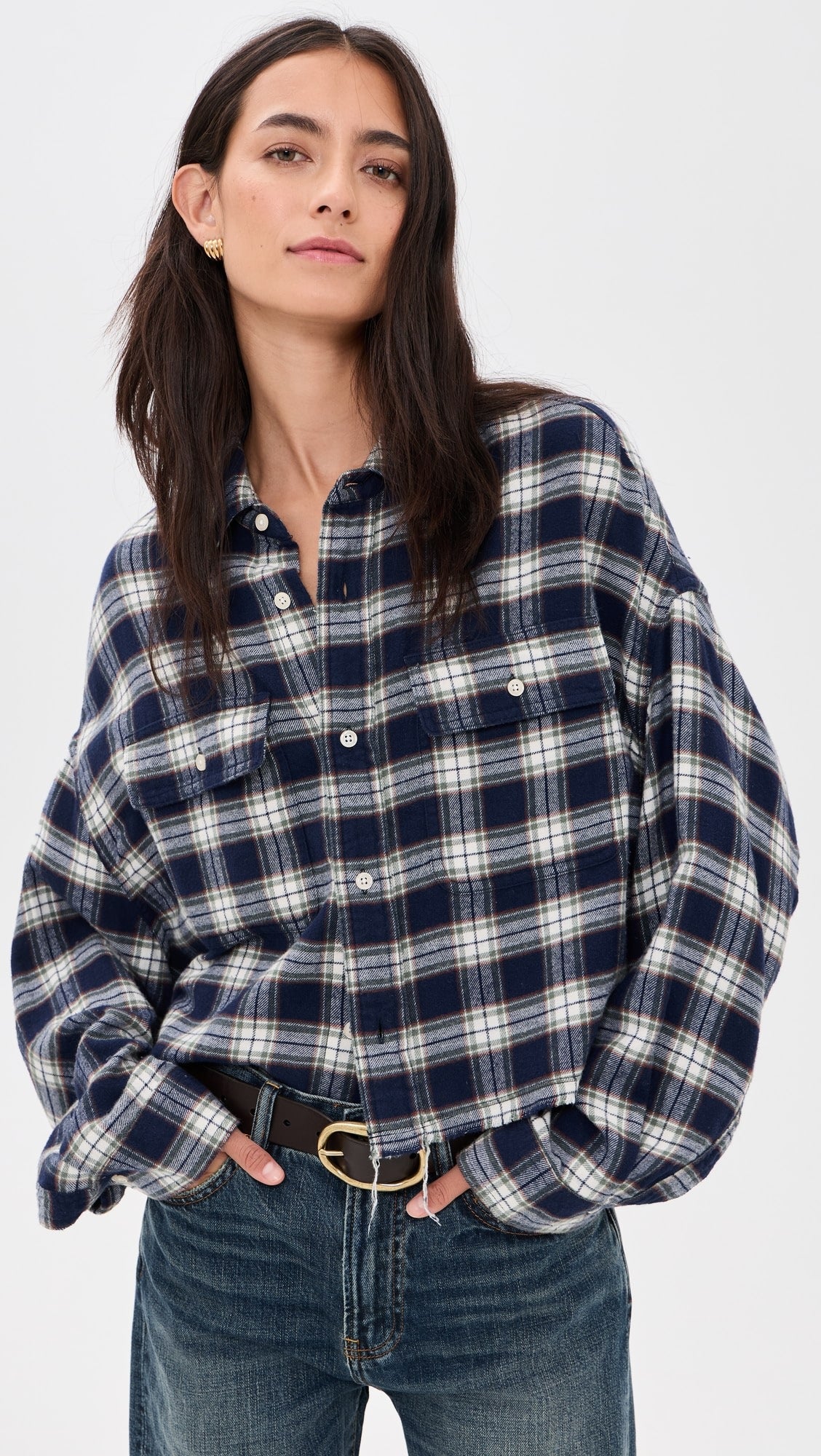 Cropped denim work shirt and jeans by Denimist, styled for a modern casual look, hands in pockets.