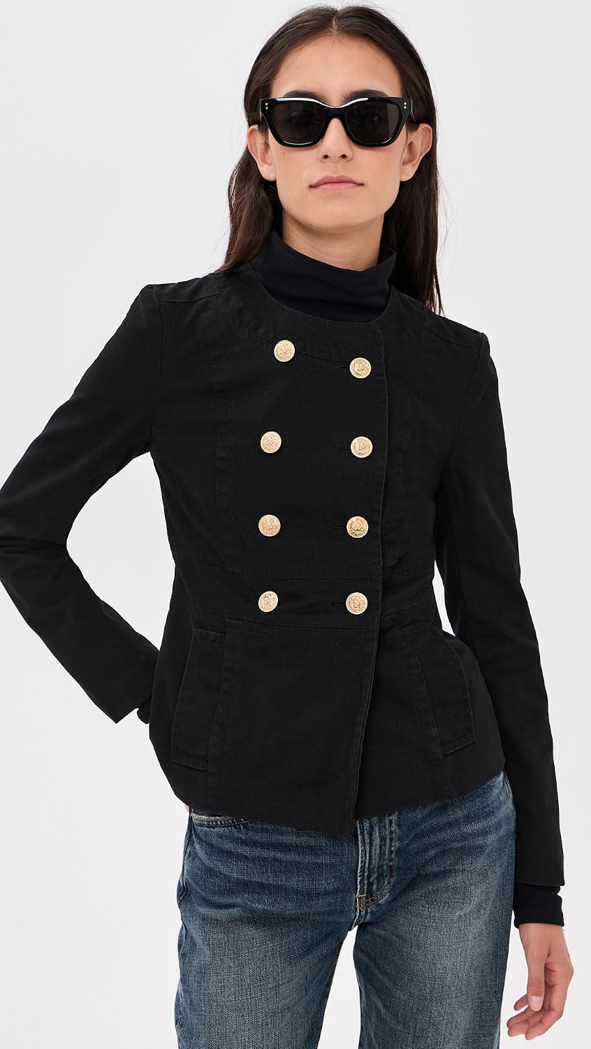 Denimist Shrunken Officer Jacket and jeans styled on a woman with sunglasses against a light backdrop.