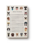 The Dog Days Notepad by Faire features tear-off sheets with lines and checkboxes, bordered by quirky dogs in glasses, scarves, and hats—adding charm to your daily to-do lists.