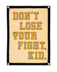 Cream camp flag with black trim and bold Don’t Lose Your Fight text by Faire for Bungalow Furniture & Accessories.