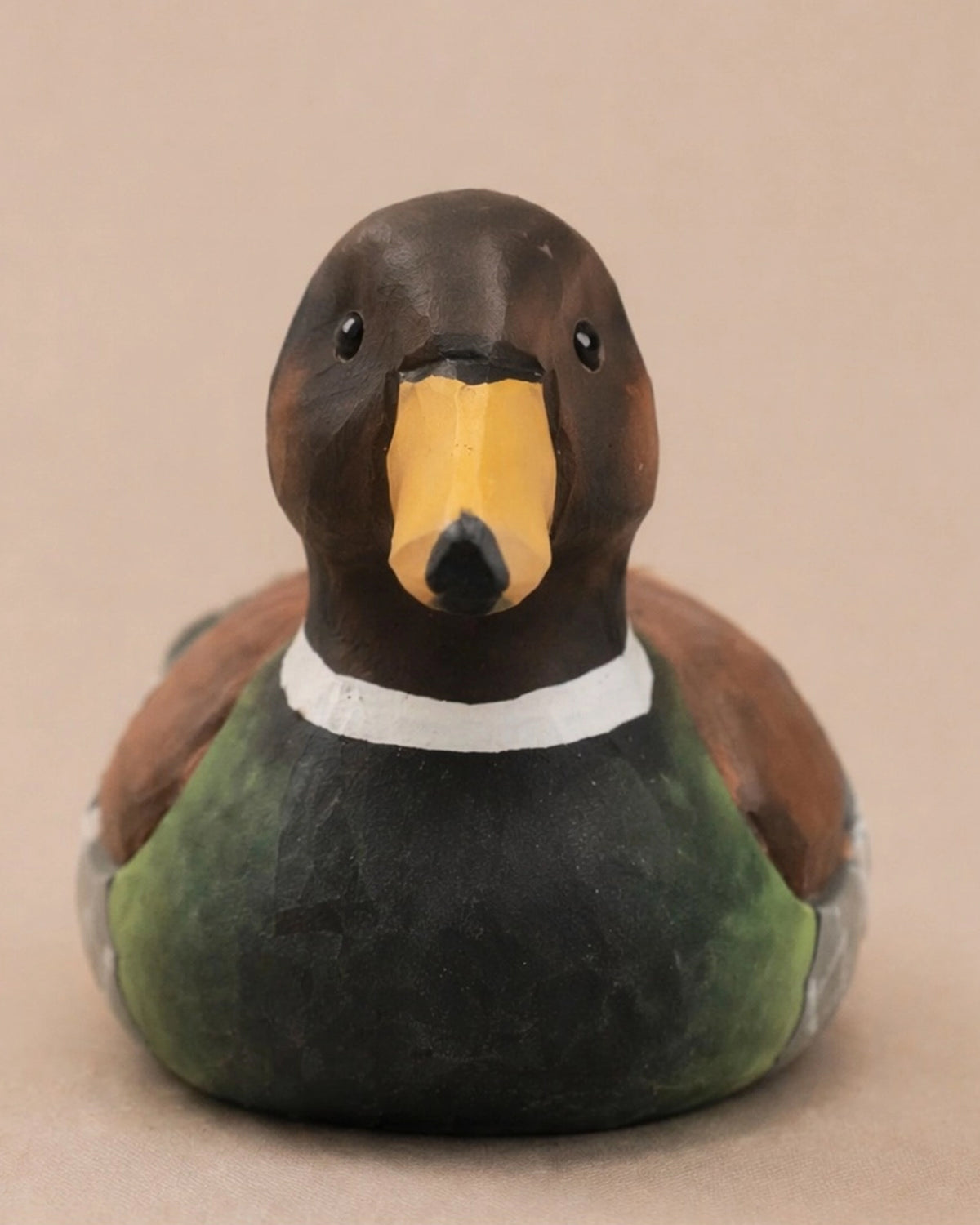 Hand-painted brown carved basswood duck figurine by Faire adds rustic charm to decor, perfect for tabletops or shelves.