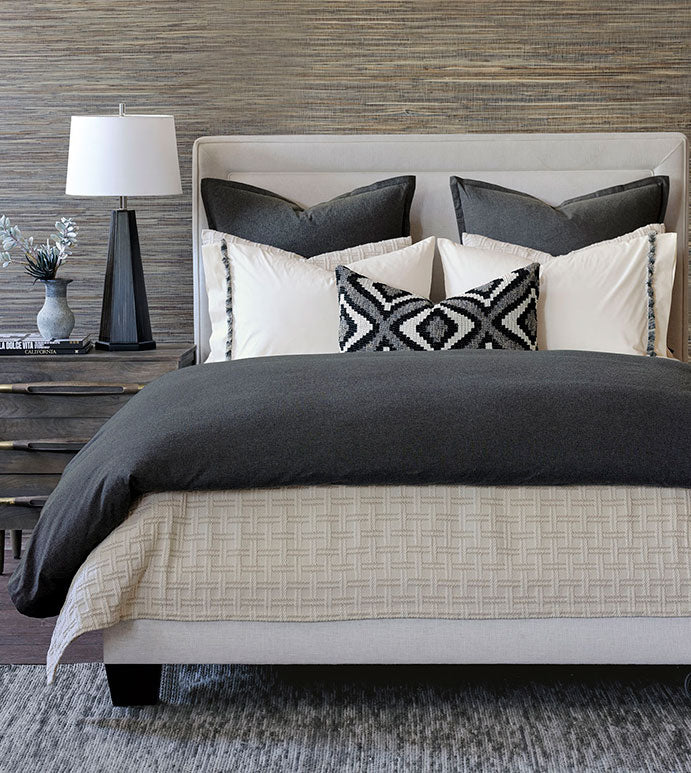 Monterosa Cotton Flannel Duvet Cover by Eastern Accents on a neatly made bed with glowing nightstands in a cozy bedroom.
