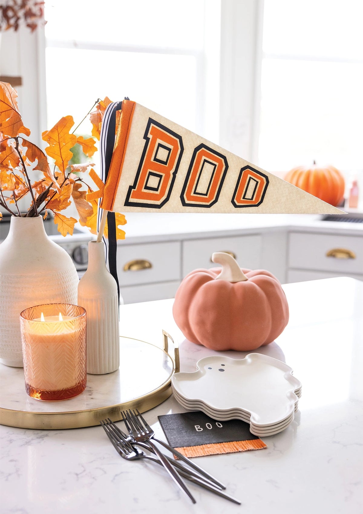 Cozy kitchen with Faire Boo felt pennant banner and autumn Halloween decor from Bungalow Furniture & Accessories.