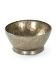 The Zentique Edgard Bowl /Antique Gold features a simple round shape with a slightly flared rim, small pedestal base, and a hammered textured surface for a decorative, reflective centerpiece.