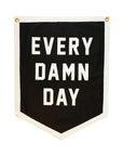Black wool felt camp flag with white trim and bold EVERY DAMN DAY lettering by Faire for home or office decor.