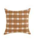The Ezra Pillow by Faire features a chic checkered pattern in brown, tan, and beige on a crisp white background.