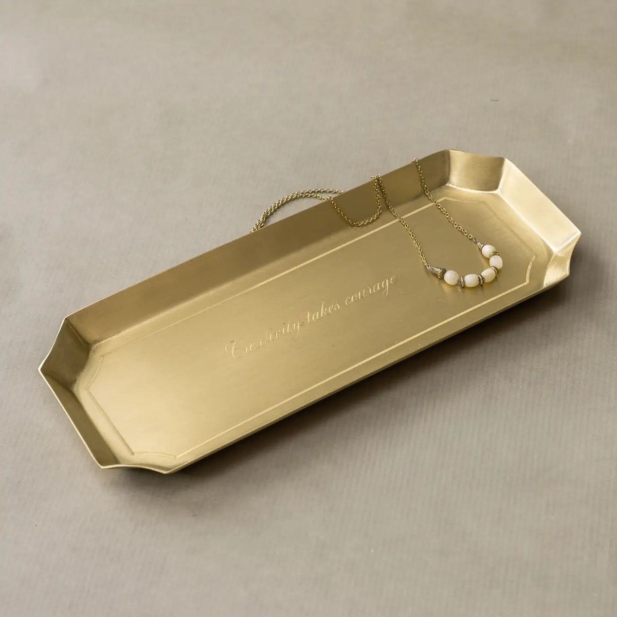 Brass desk tray with engraved Creativity Takes Courage, by Faire, elegant accent for jewelry or decor.
