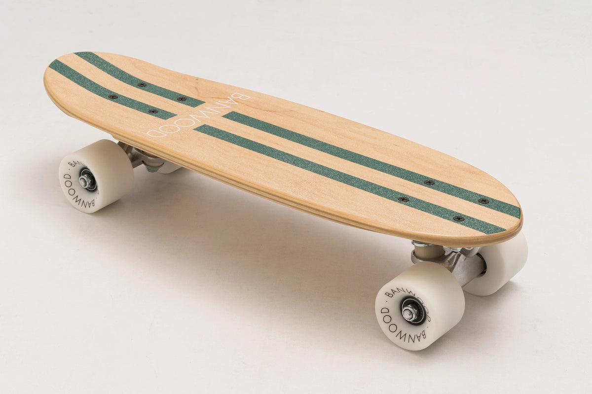 The BANWOOD SKATEBOARD - GREEN by Faire is crafted from Canadian Maple, with two green stripes, white wheels, silver trucks, and "BANWOOD" on the deck—delivering a classic cruiser look.