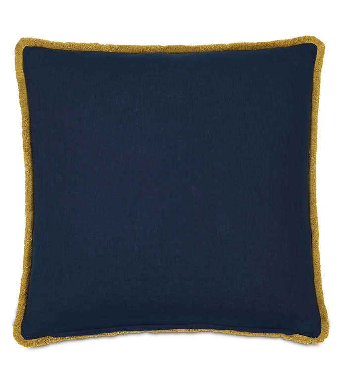 The Fairuza Embroidered Pillow by Eastern Accents is a square navy blue linen decorative pillow with mustard yellow fringe trim, displayed against a white background.