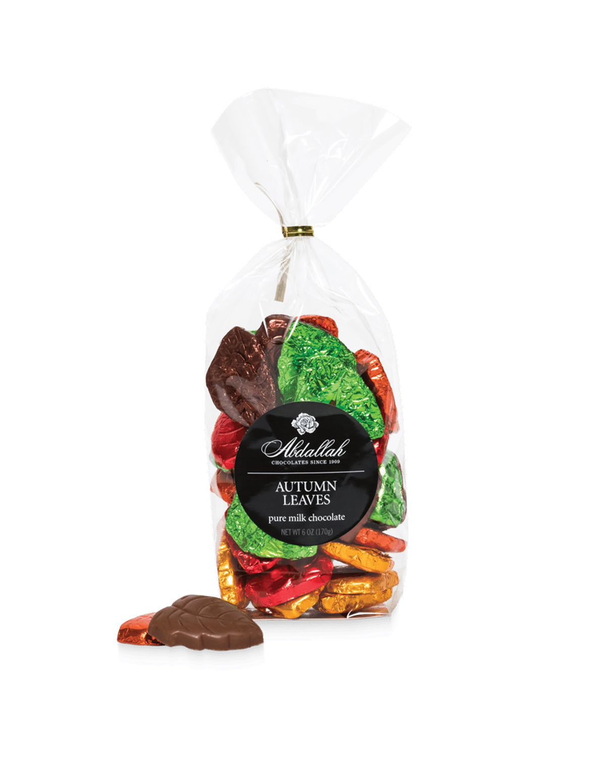 Milk chocolate autumn leaf candies, one unwrapped, in Abdallah 8oz bag at Bungalow Furniture &amp; Accessories.