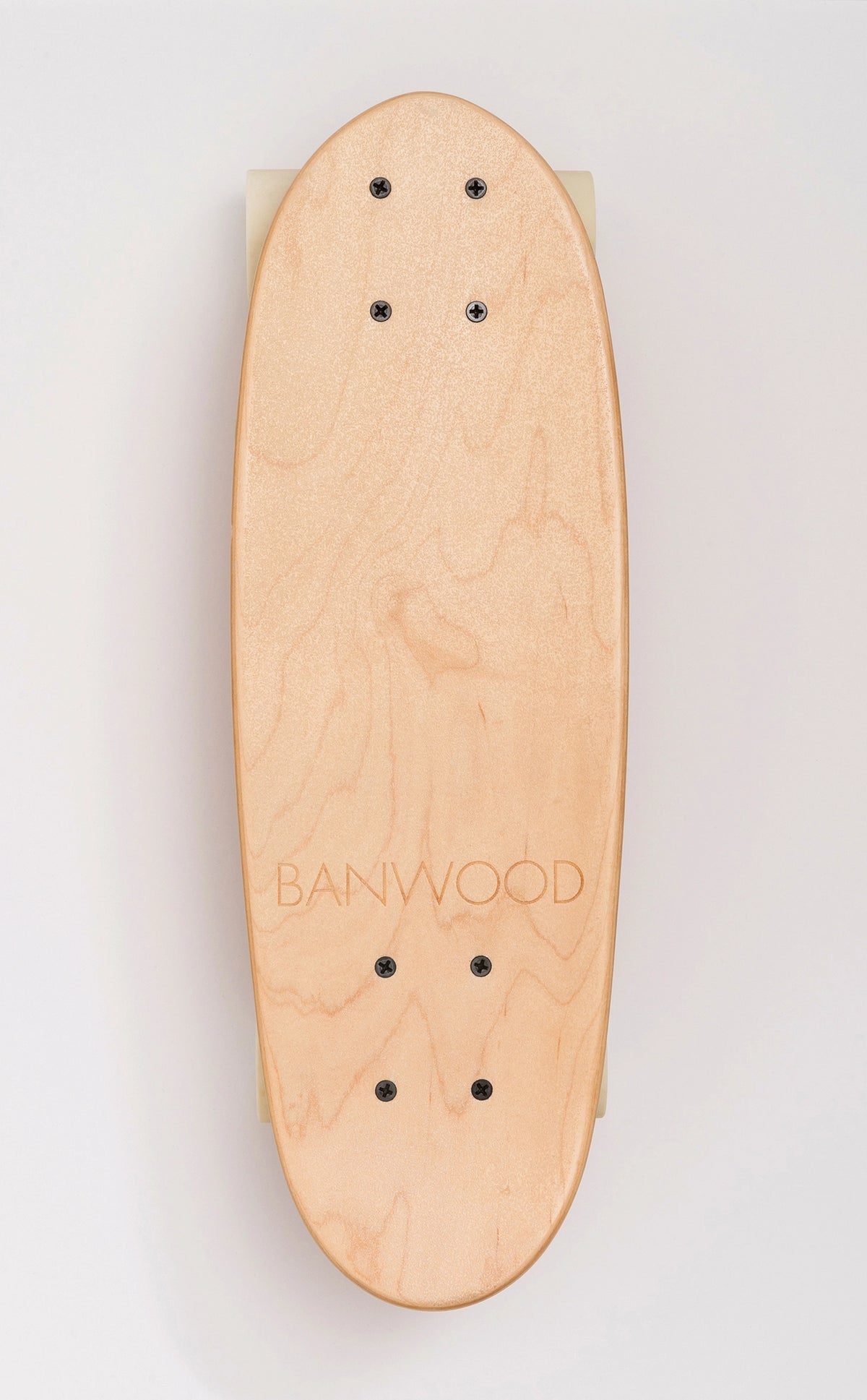 The BANWOOD SKATEBOARD - NATURE by Faire is a cruiser board made from Canadian maple with a natural finish, visible wood grain, black screws, and "BANWOOD" engraved near the bottom, shown on a light background.