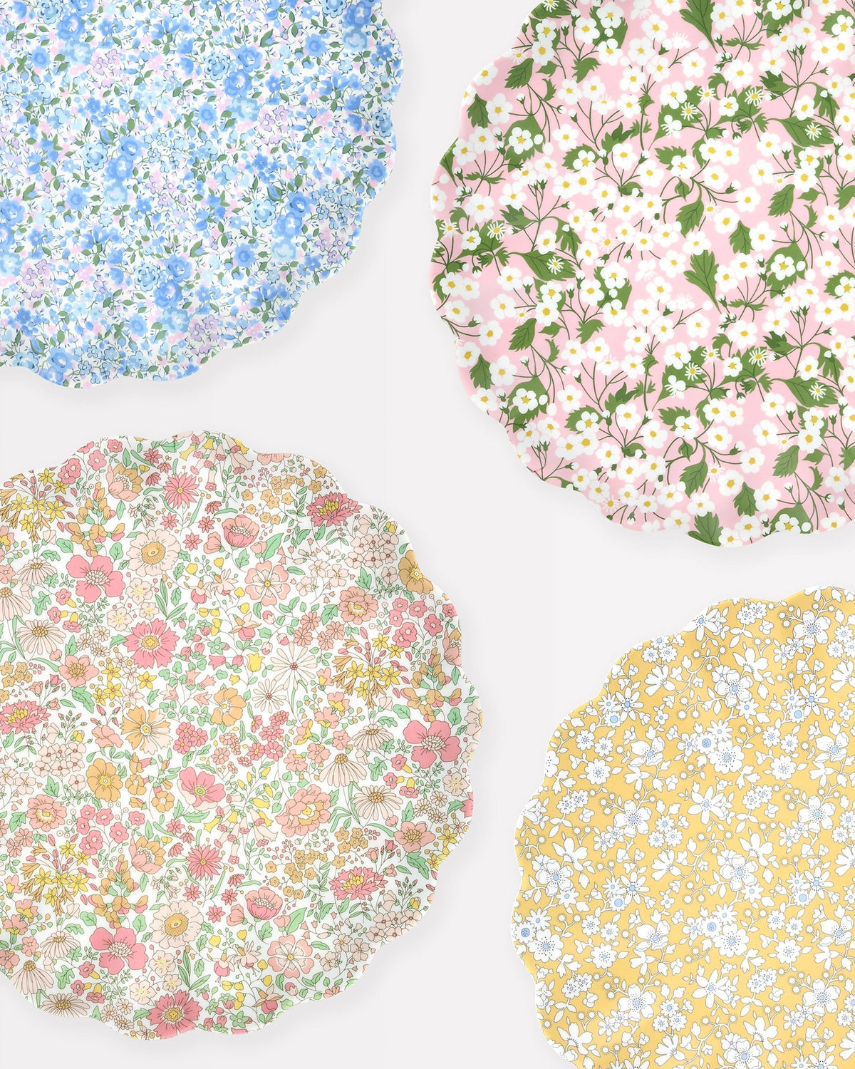 Set of 4 large floral plates in blue, pink, and yellow by Meri Meri x Liberty for Bungalow Furniture & Accessories.